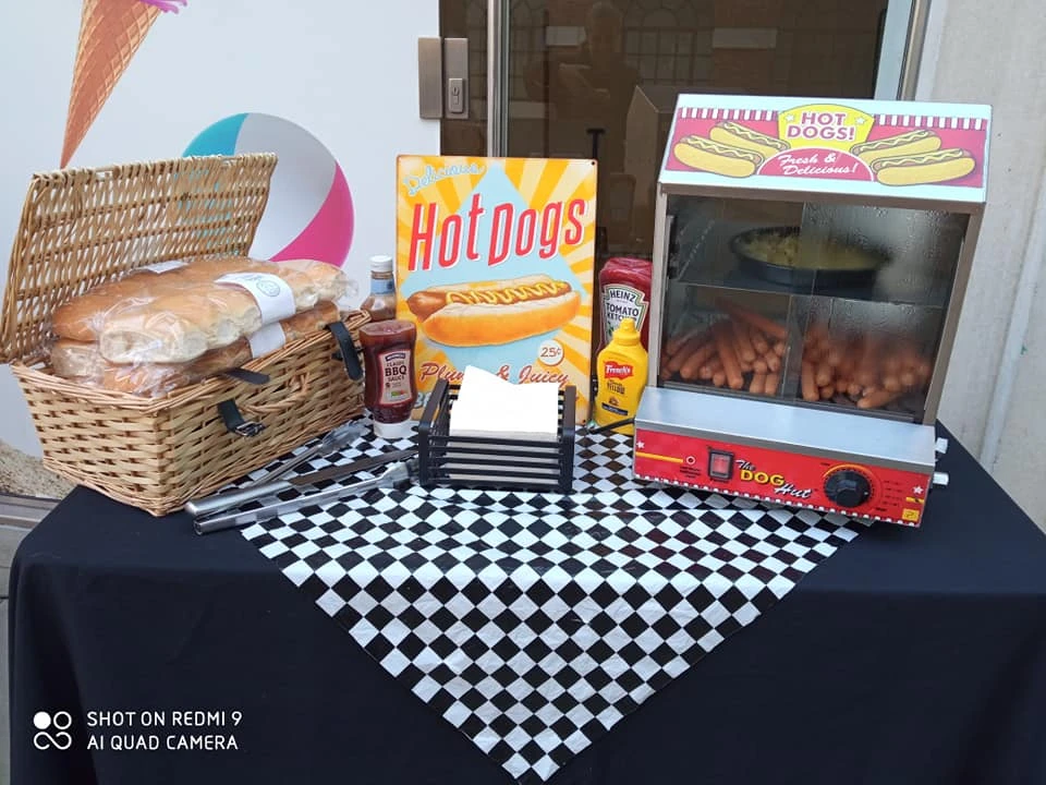 Hot dog stand with a branded hot dog warmer and condiments