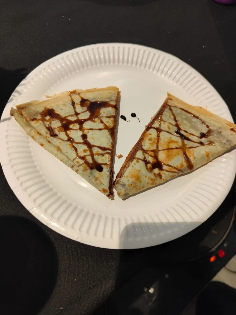 Crepe with chocolate sauce on a plate