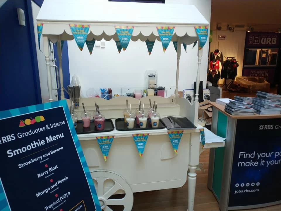 Smoothie bar with menu at a corporate event