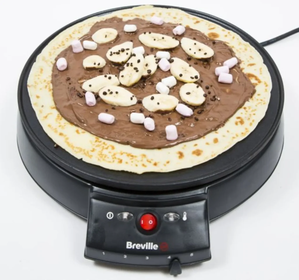 Chocolate spread crepe on an electric crepe maker