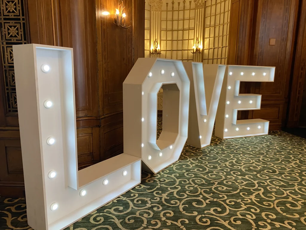 Large light-up LOVE letters in a function room